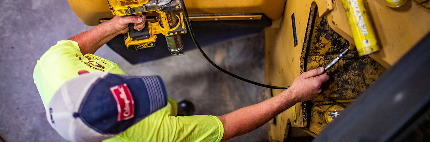 Man, tractor and power tool