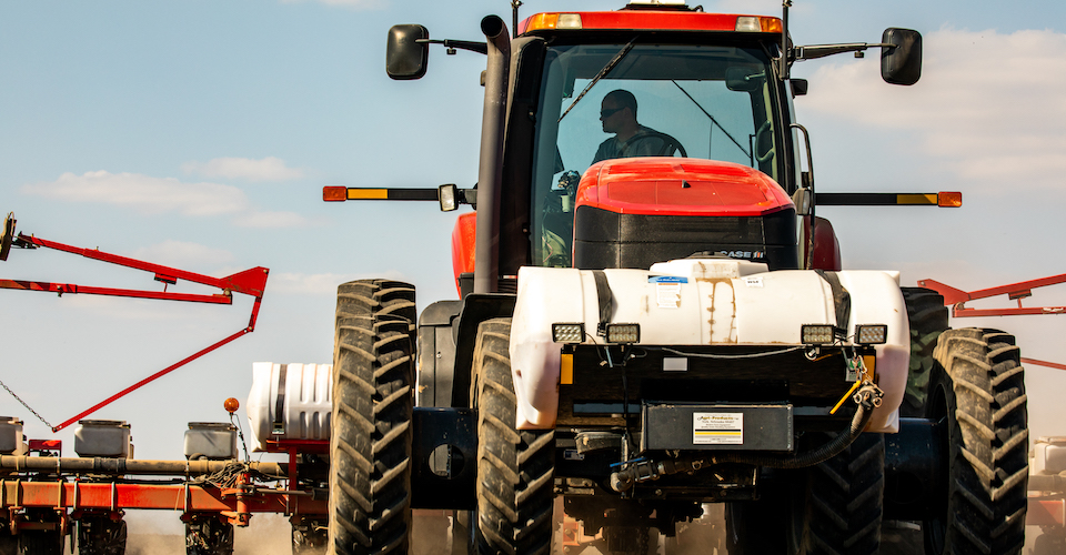 Tractor with a spreader