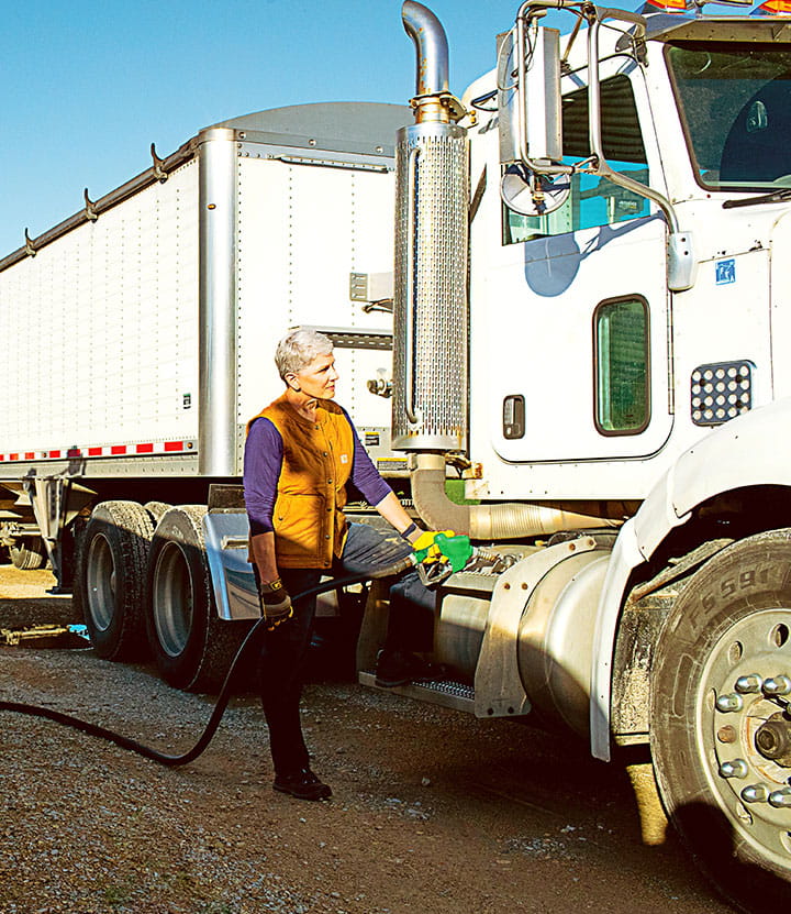 Theresa fueling a semi truck