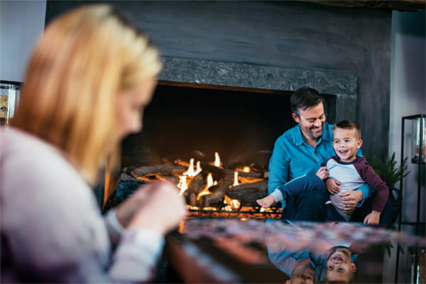 a-family-interacting-in-front-of-the-fireplace_Ratio3-2