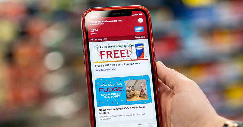 Cenex Zip Trip app in hand