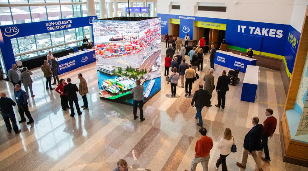 Rows of people facing a stage