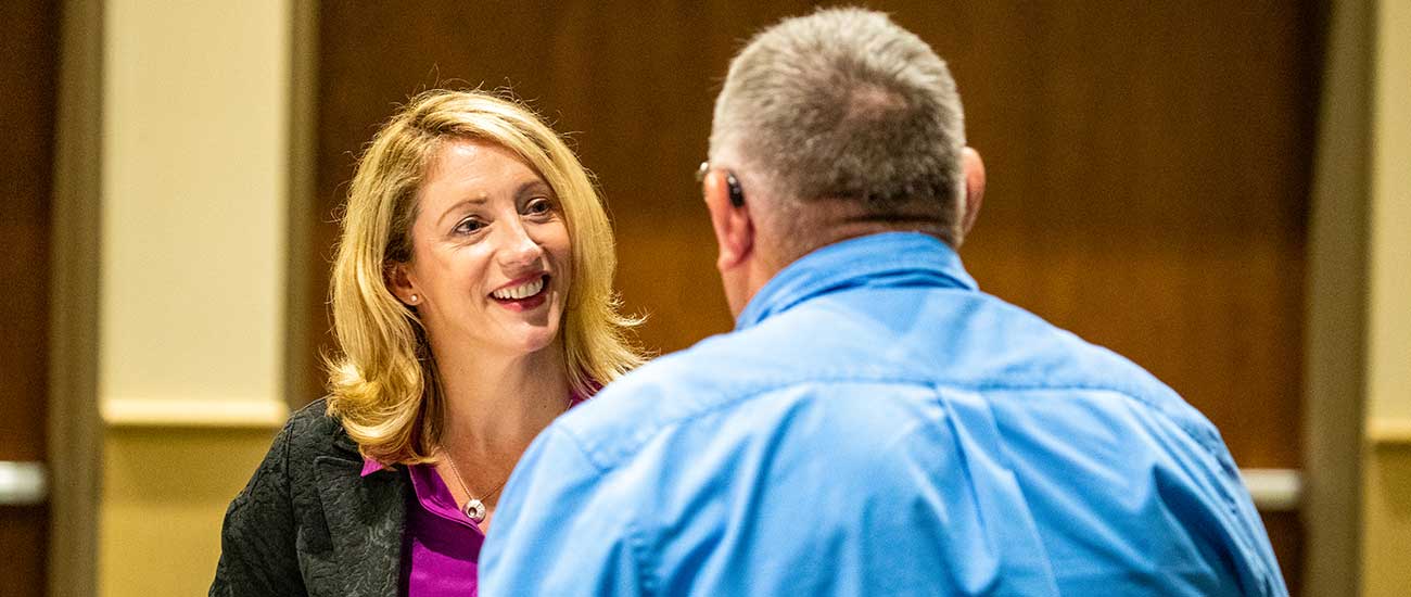 man and woman talking