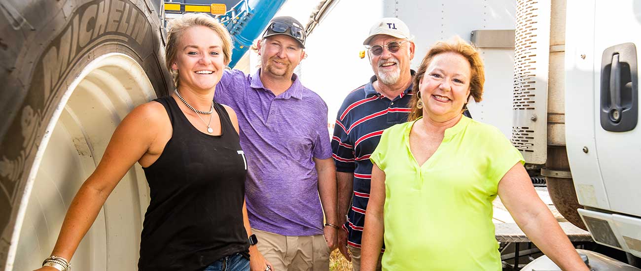 family standing by machinery