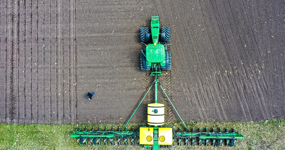 Tractor planting a field