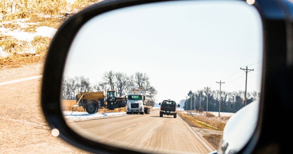Truck reflected in a vehicle's side mirror