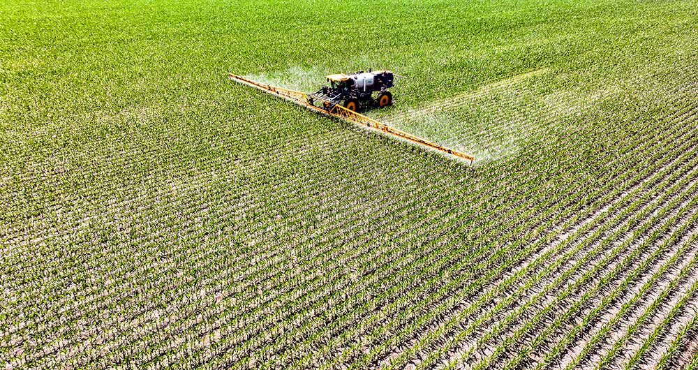 Applicator applying adjuvants to field