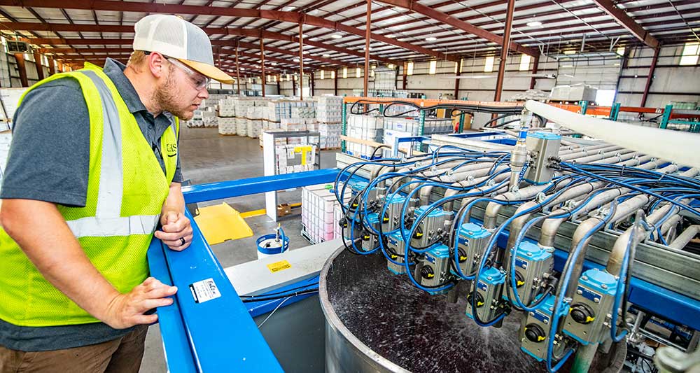 Mixer overlooking seed treatment mixing at facility