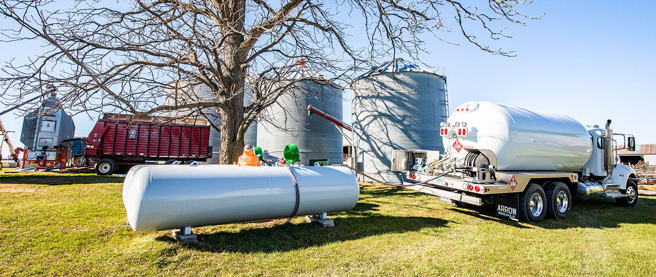 Propane truck filling a propane tank