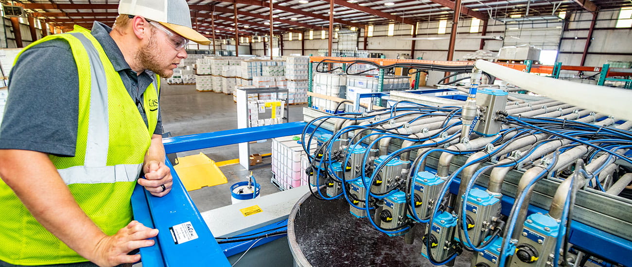 CHS blender and operator working on the seed treatment operation and delivery