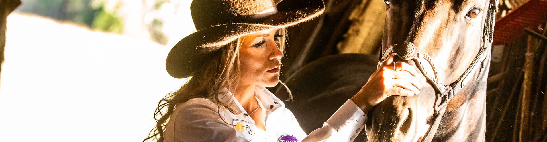 Cowgirl caring for horse