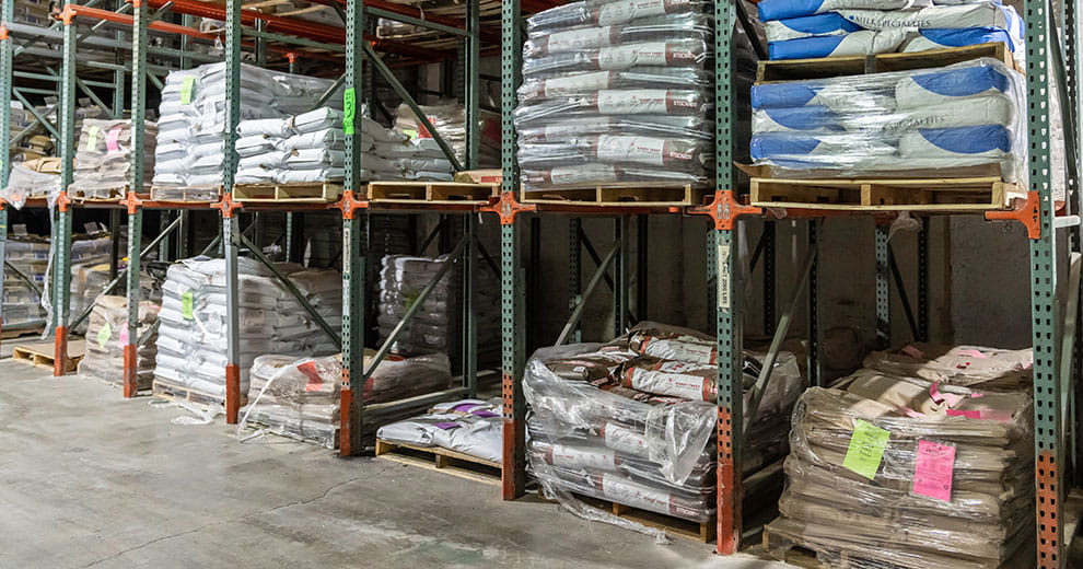 Equis warehouse warehouse shelves with Equis feed bags