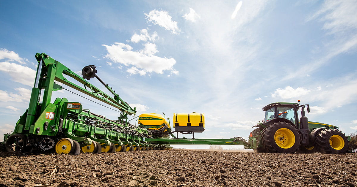 Producer driving a tractor in a field