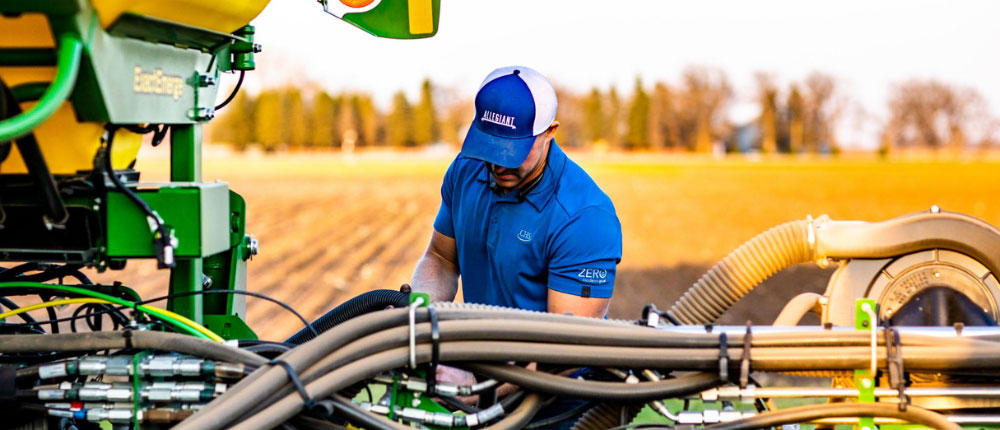 man filling up a planter