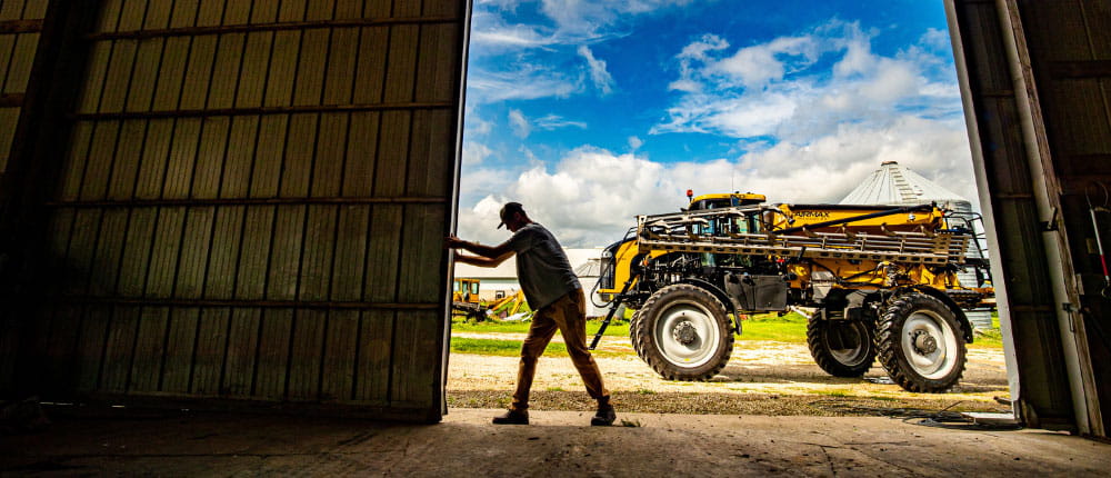 man opening a shop door