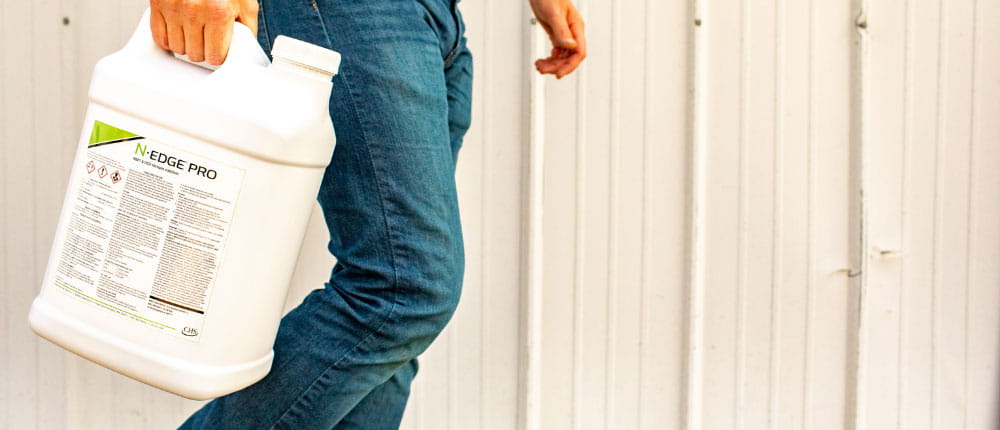 person carrying a bottle of n-edge