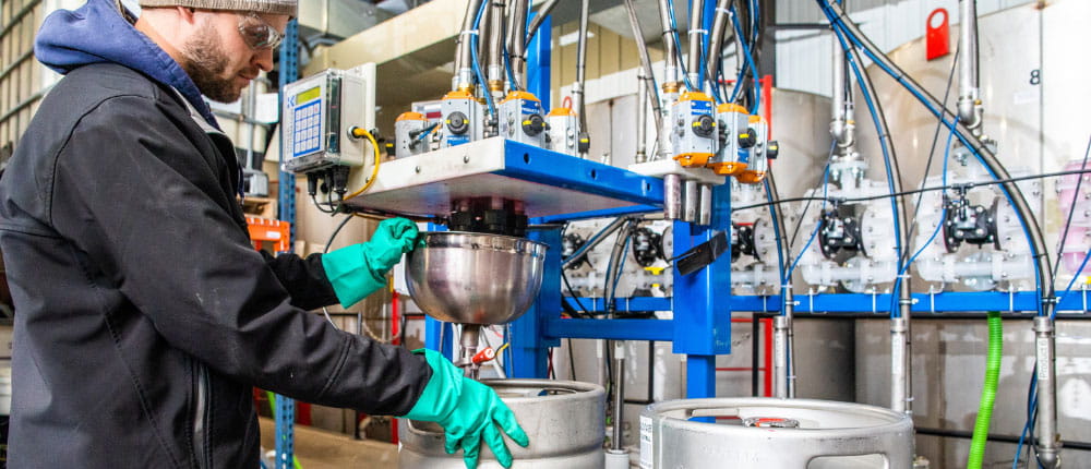 employee creating STI customized seed treatment