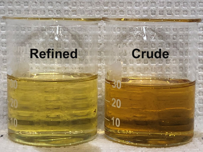jars of refined soybean oil and crude oil