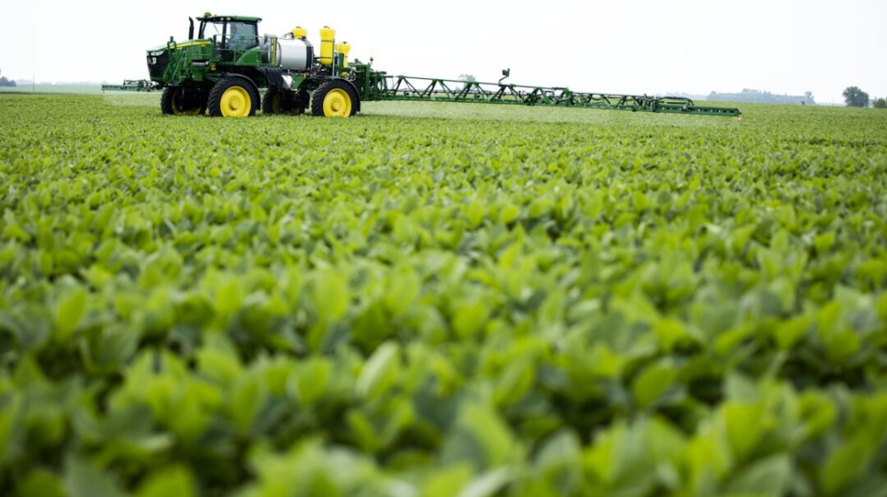 Sprayer in crop field