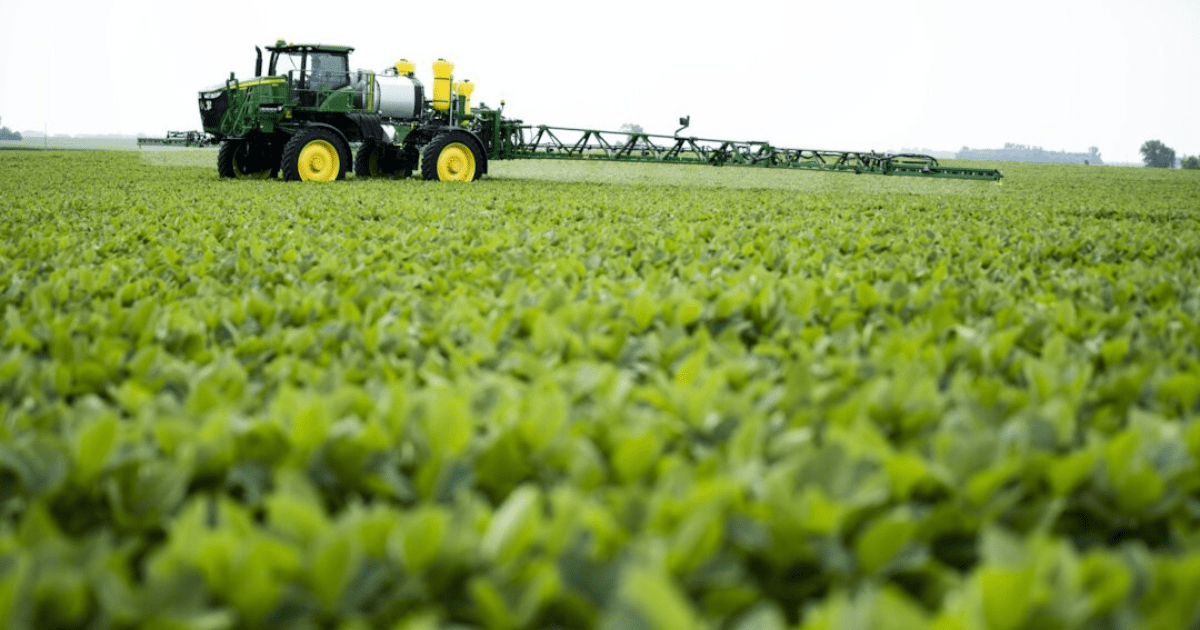 Sprayer in crop field