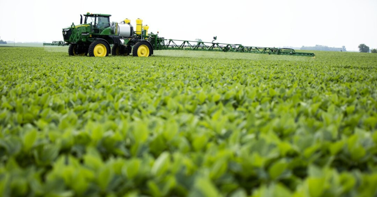 Sprayer in crop field