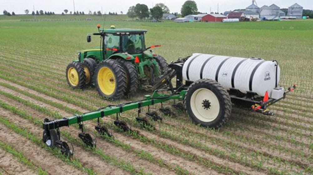 Tractor doing sidedress application in a field