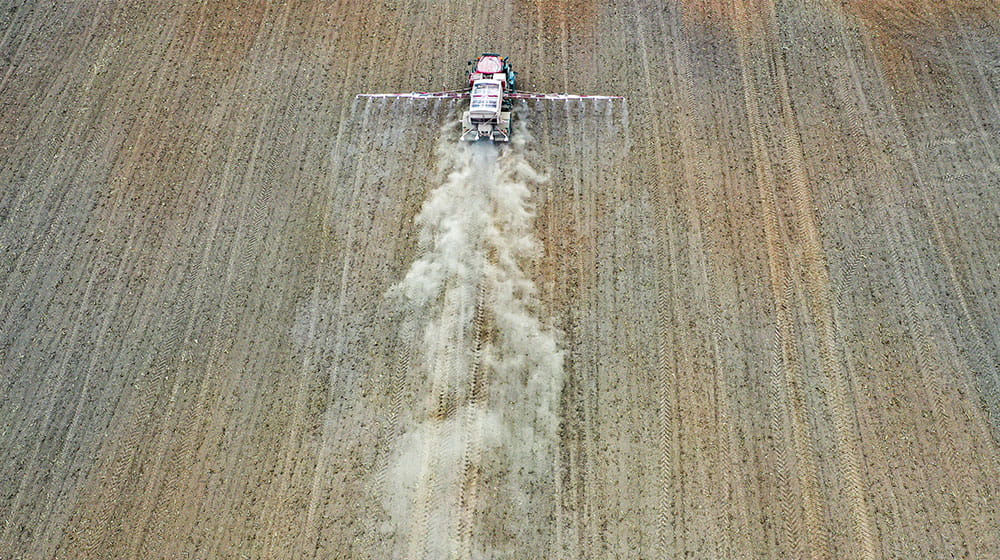 Fertilizer being spread in a field