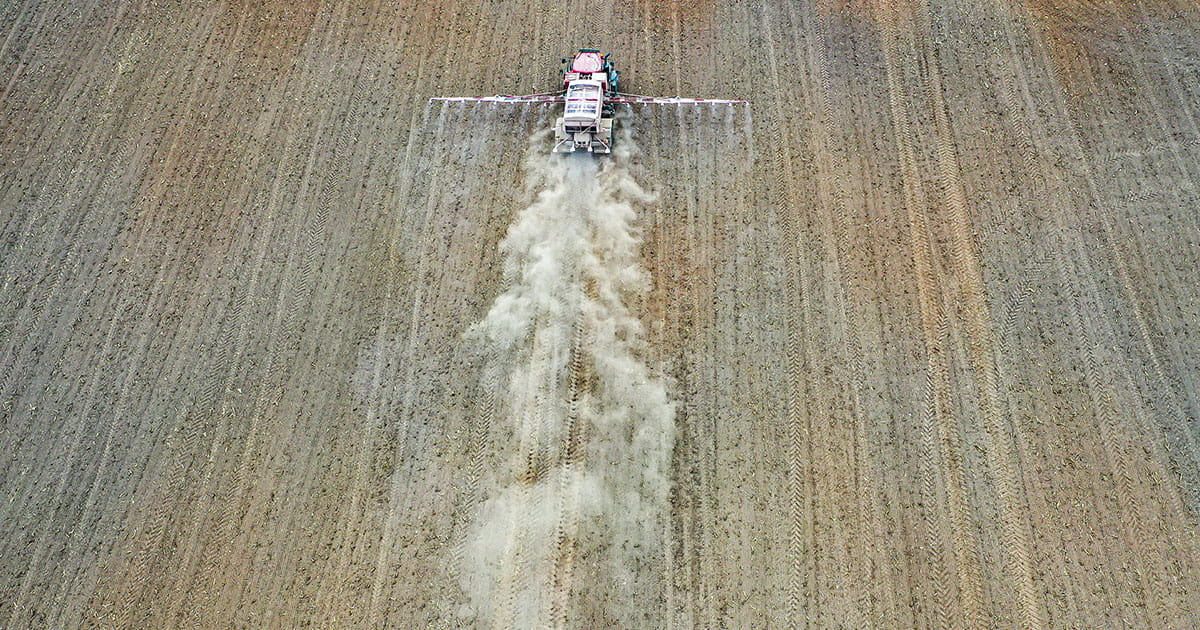 Fertilizer being spread in a field