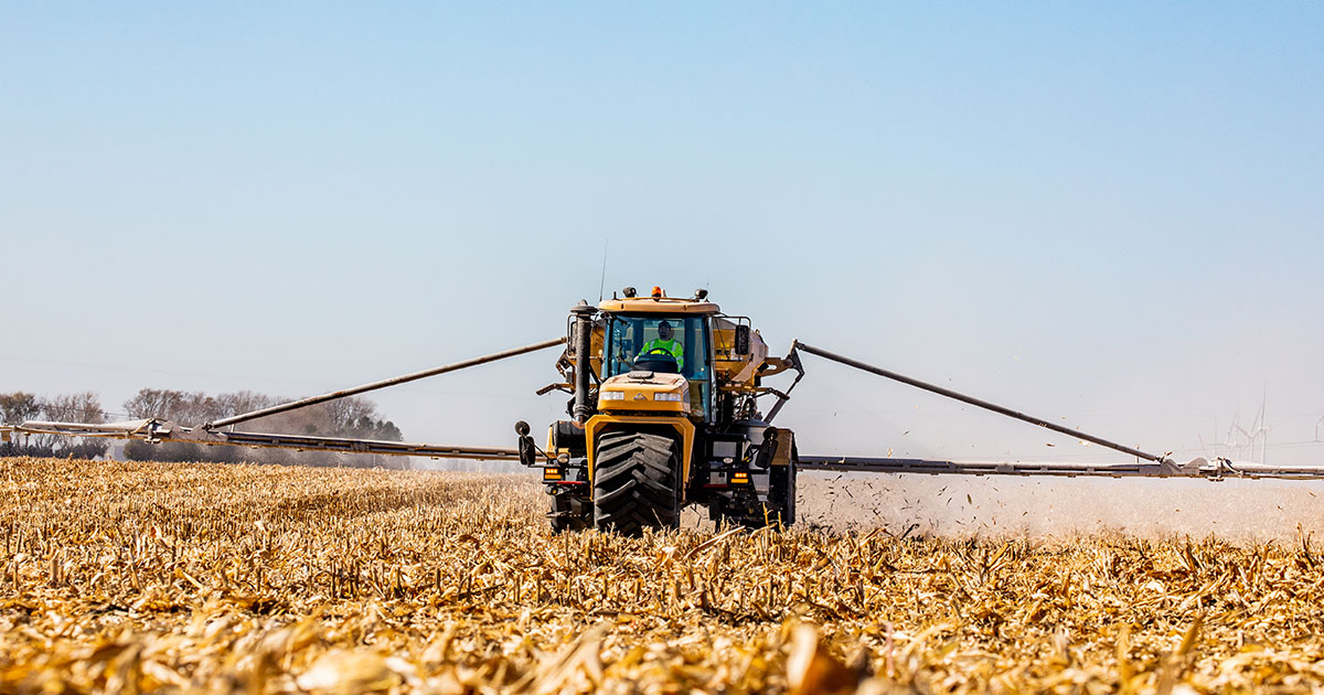 Tractor in a field after harvest