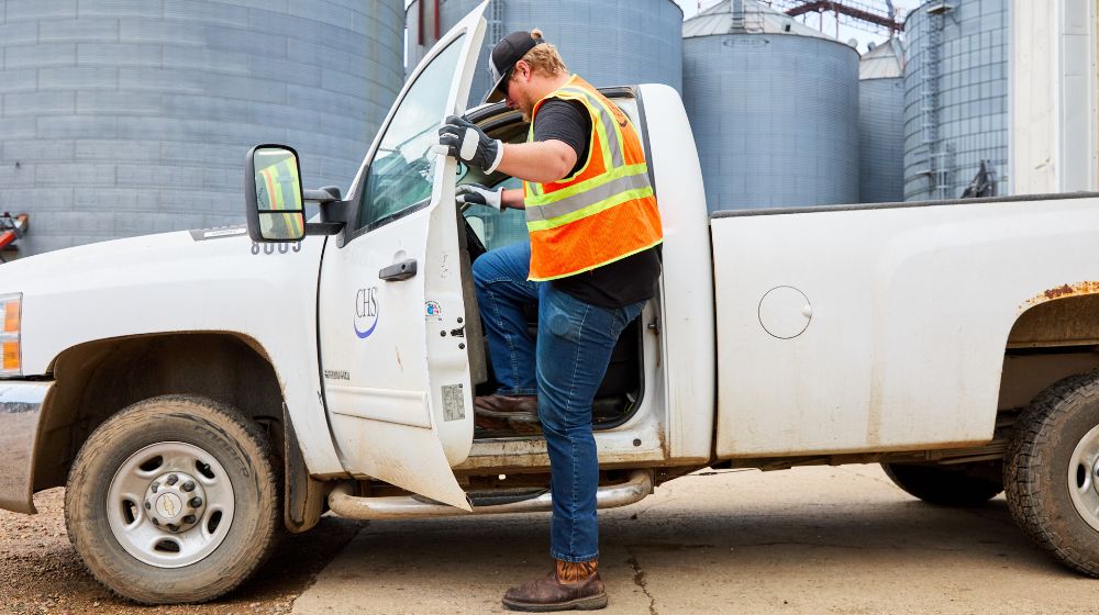 A man getting into a truck.