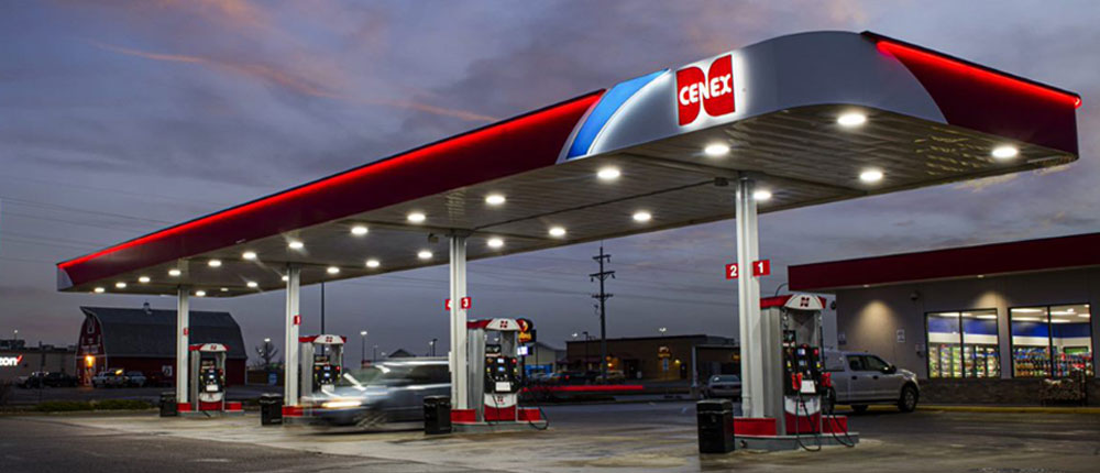 A Cenex gas station and fuel canopy is show lit at night.