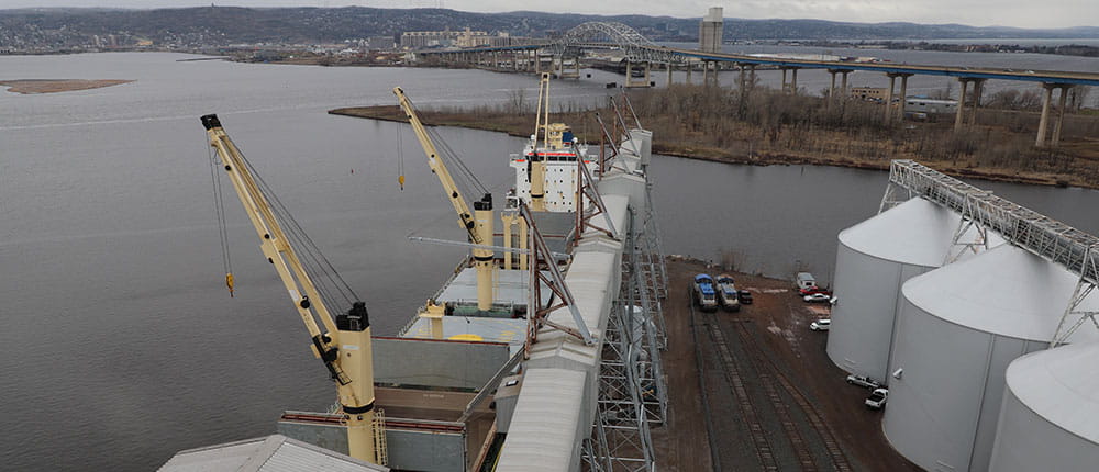 Loading wheat into a ship.
