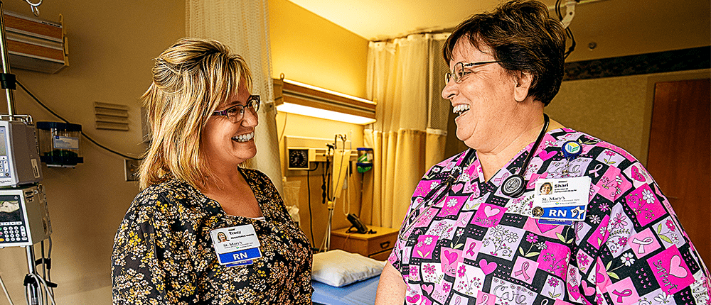 Two nurses in a hospital room
