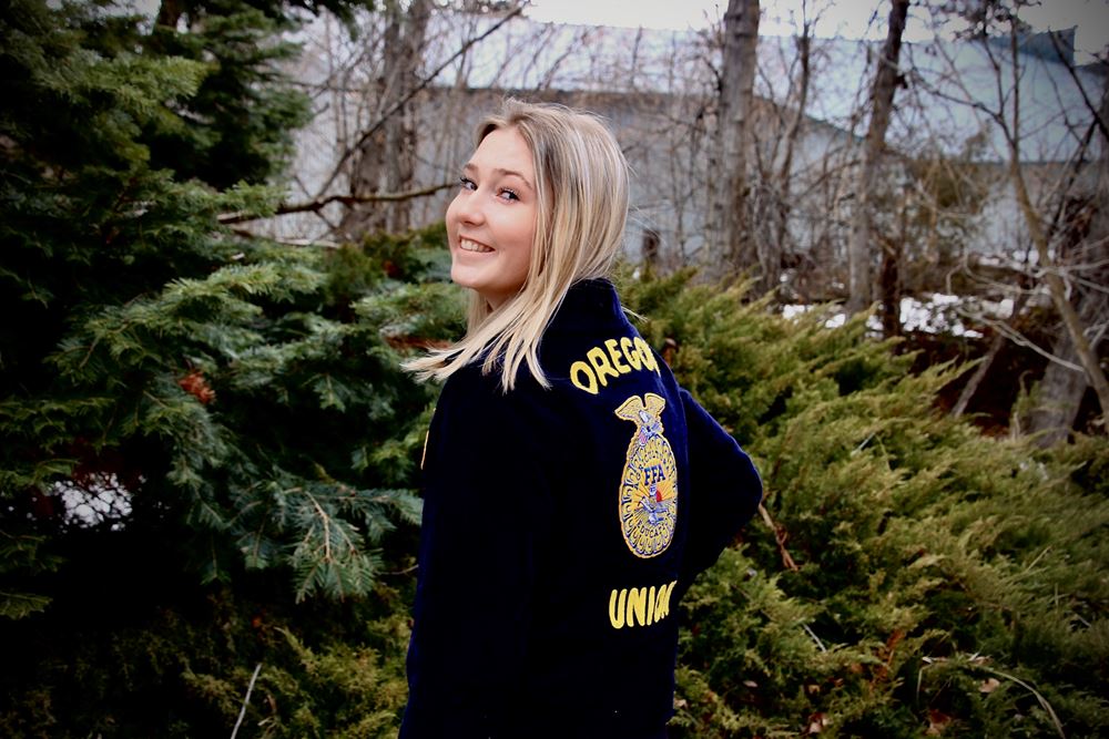 FFA student Delaney Klebaum shows off her FFA jacket