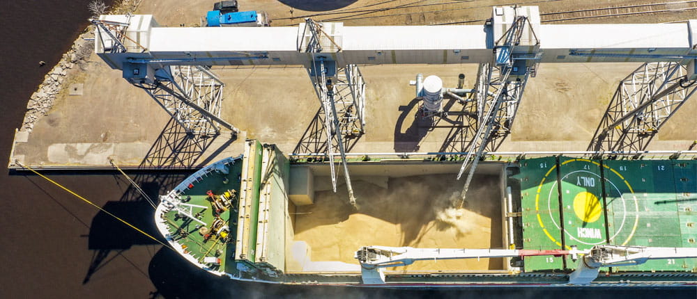 A ship is loaded with wheat before being sent to global markets.