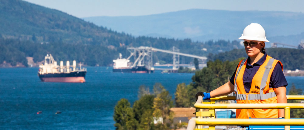 A TEMCO employee looks out over the ocean in Kalama, Washington.
