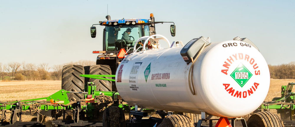 Farmer applying anhydrous ammonia to a field