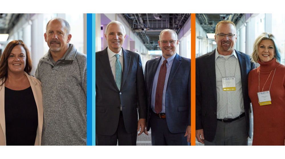 Group of people in business attire posing inside Minneapolis Convention Center
