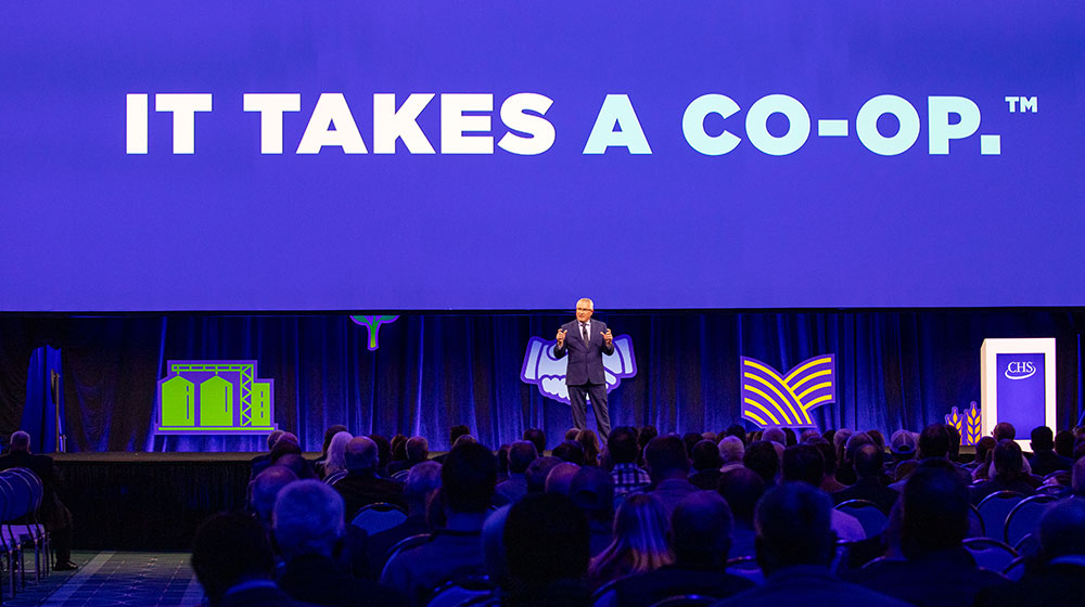 man speaking on a stage