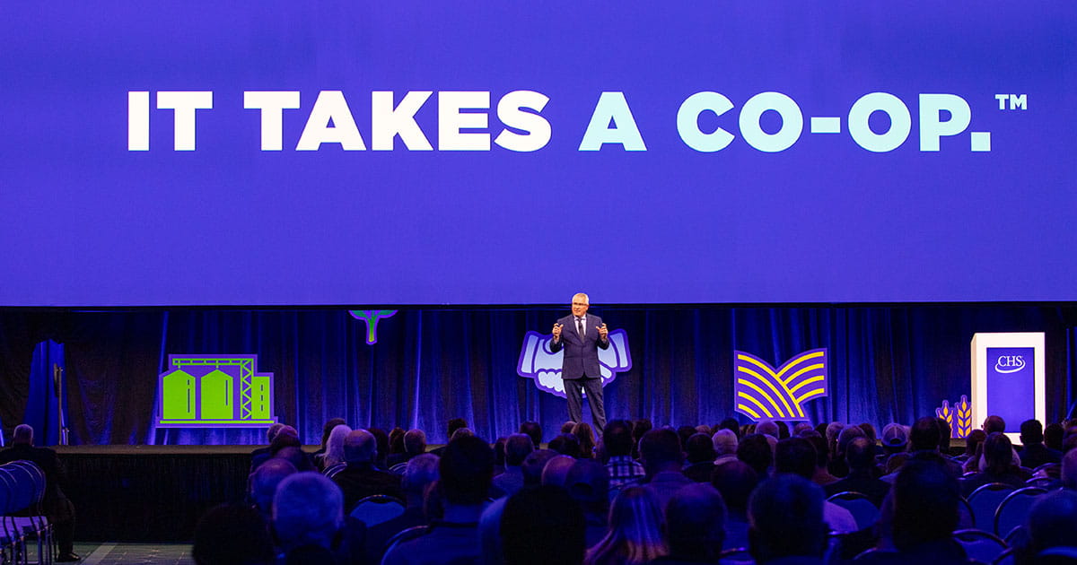 man speaking on a stage