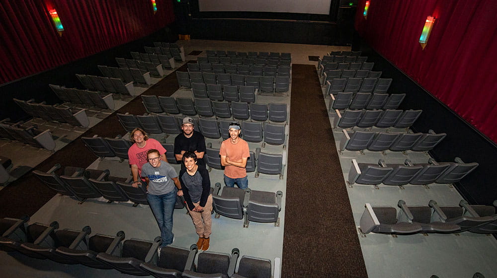 People standing in a movie theater