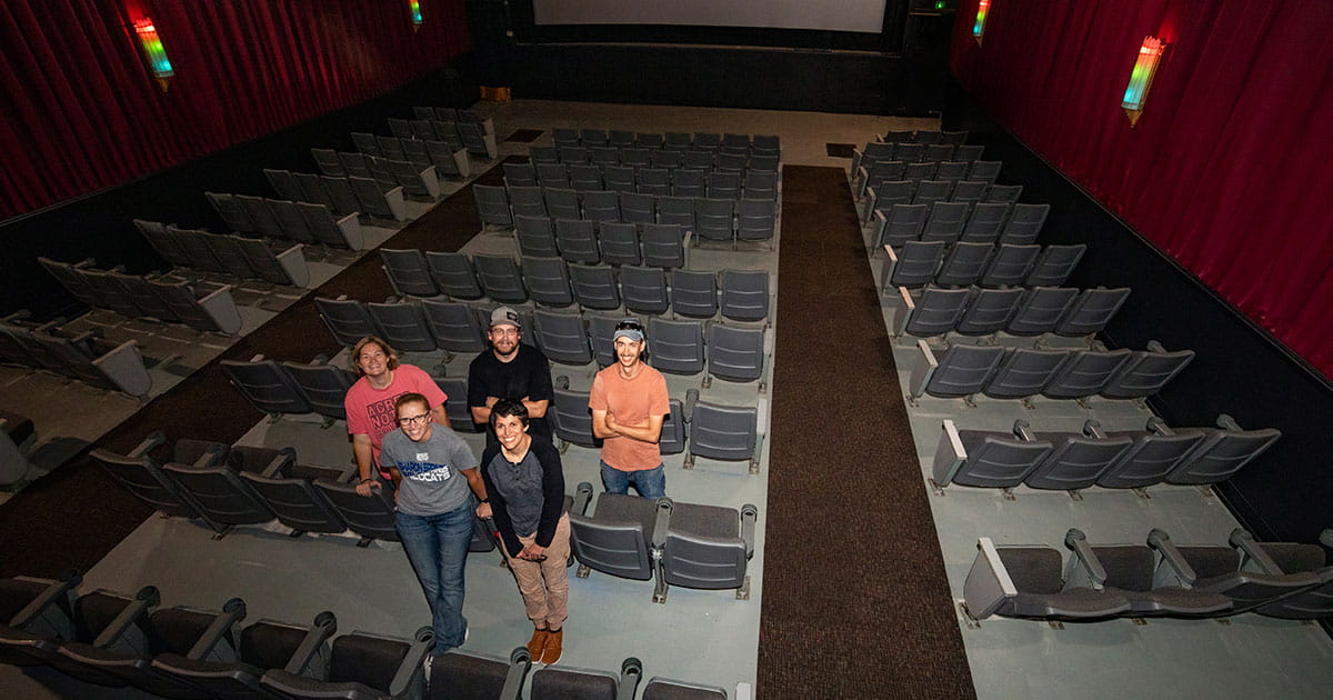 People standing in a movie theater