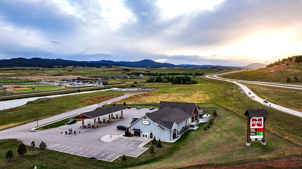 Aerial photo of travel plaza next to a highway