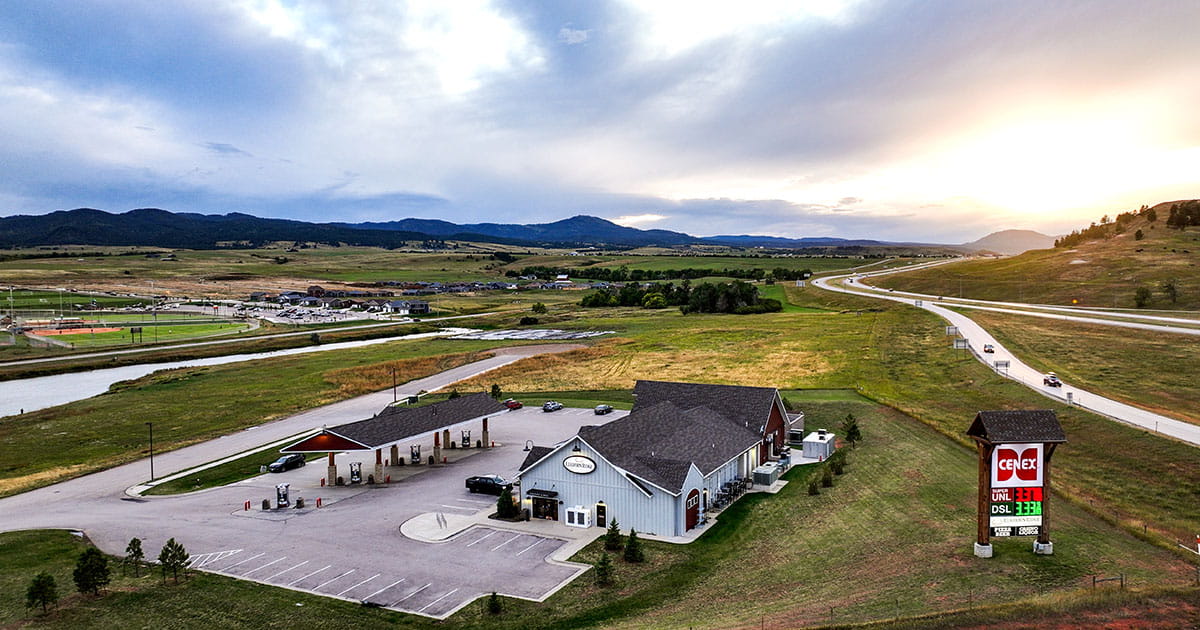 Aerial photo of travel plaza next to a highway
