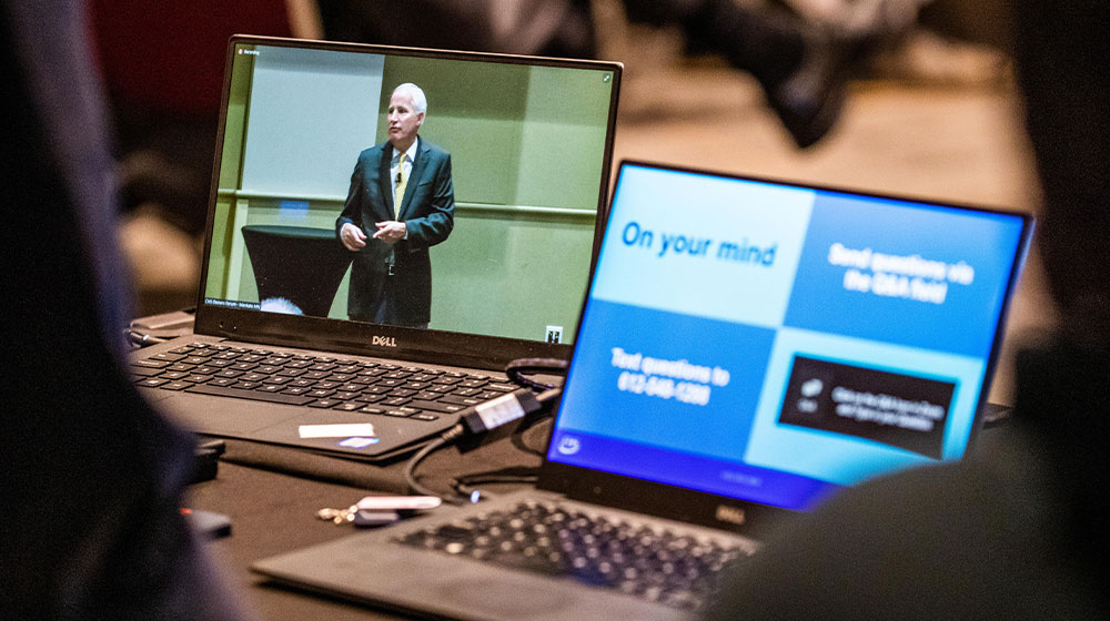 Laptop screens showing virtual owner forums