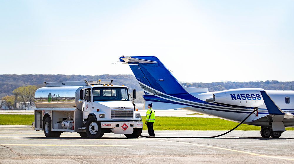 Fuel truck fueling airplane