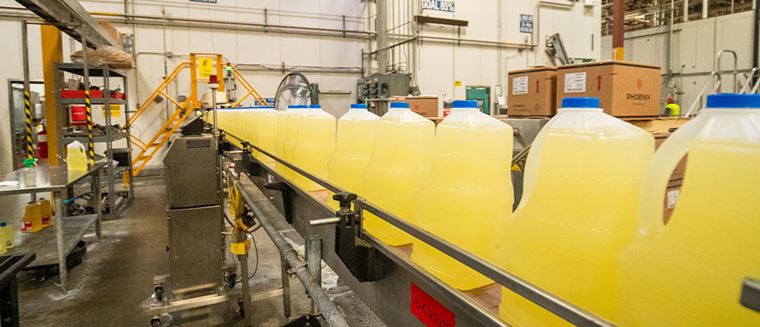 Bottle of frying oil on assembly line
