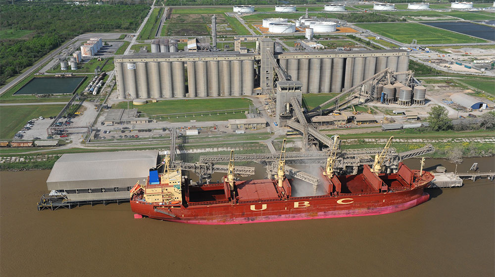 Freight ship beside a refinery