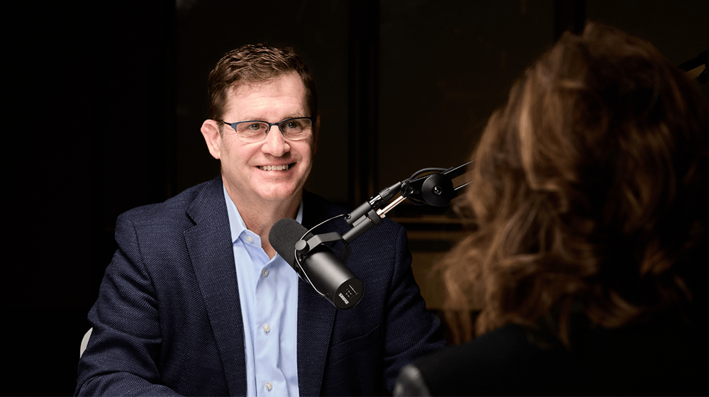 Nelson Neale speaking into a microphone