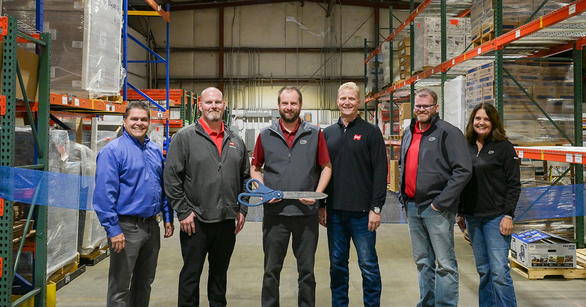 people in a warehouse with a scissors
